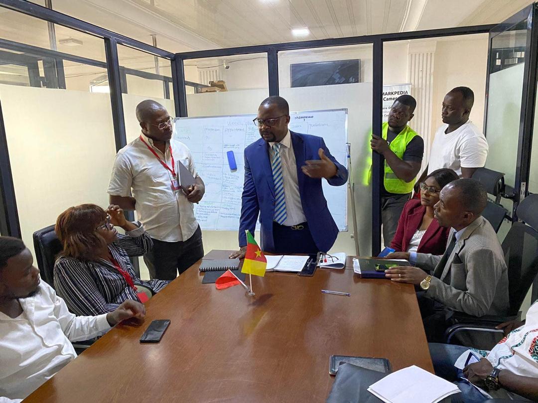 Markpedia Cameroon team discussing trade operations